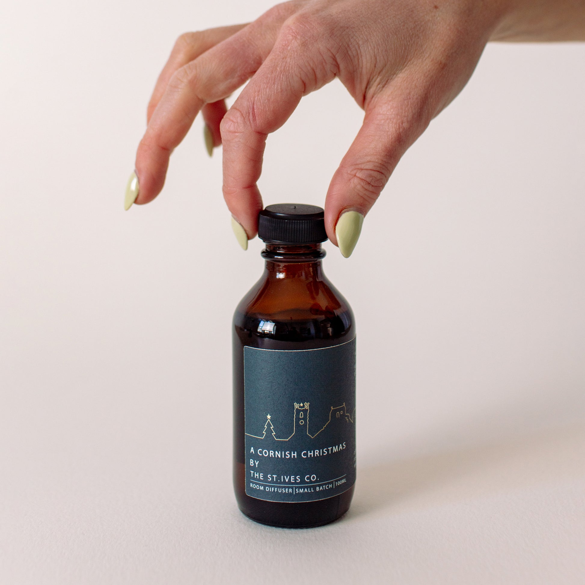 A Cornish Christmas diffuser oil with reeds included- made in St Ives Cornwall exclusively for the St Ives Co. Artisan. hand made - amber bottle