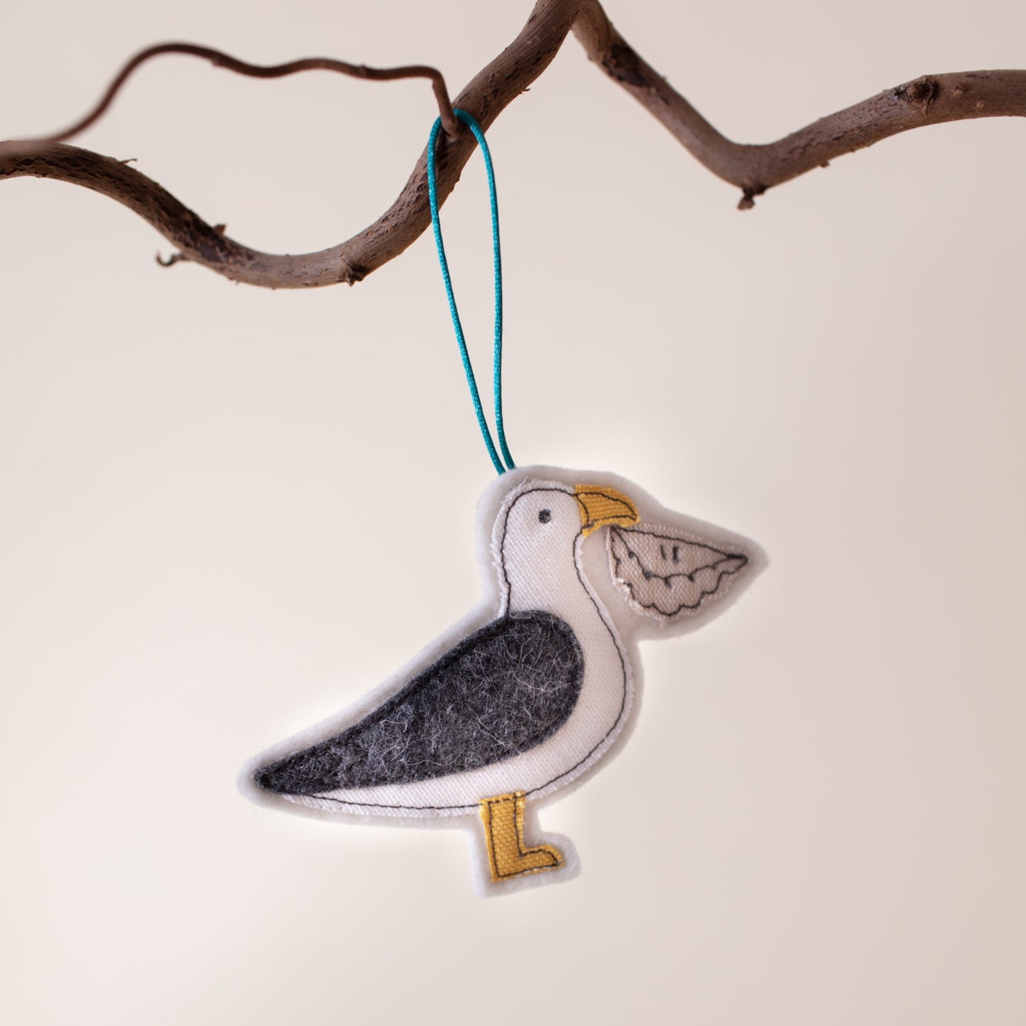 Seagull with pasty hanging