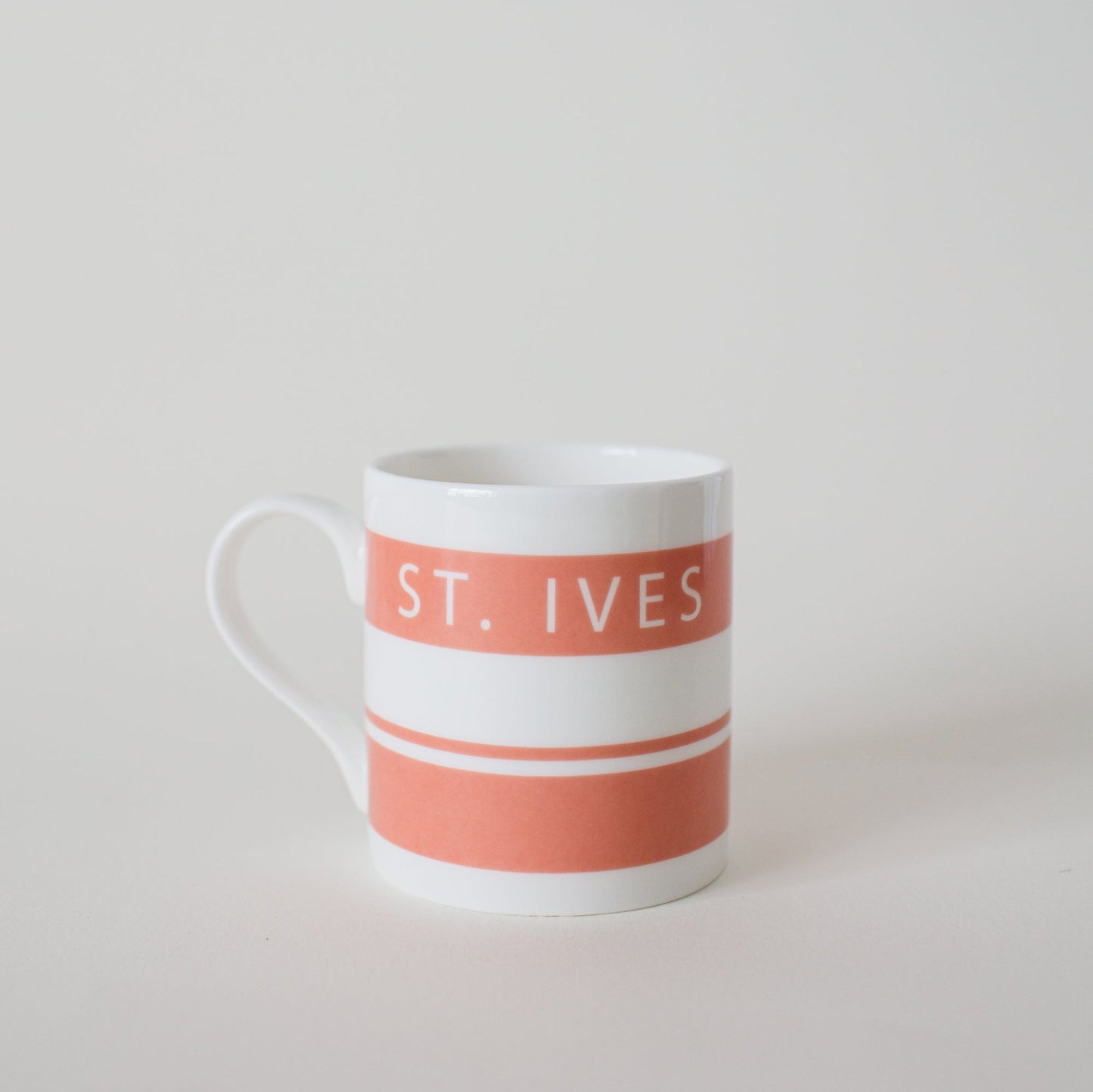 Salmon Pink Cornish stripe Mug with St vet written on one side- Designed in St Ives- Cornwall.