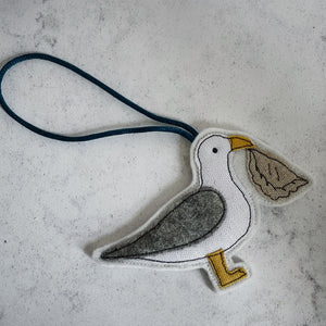 Seagull with pasty hanging